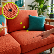 Realistic cigarette burn in coral woven sofa upholstery with a matching magnified close-up and a hand pointing to the damage