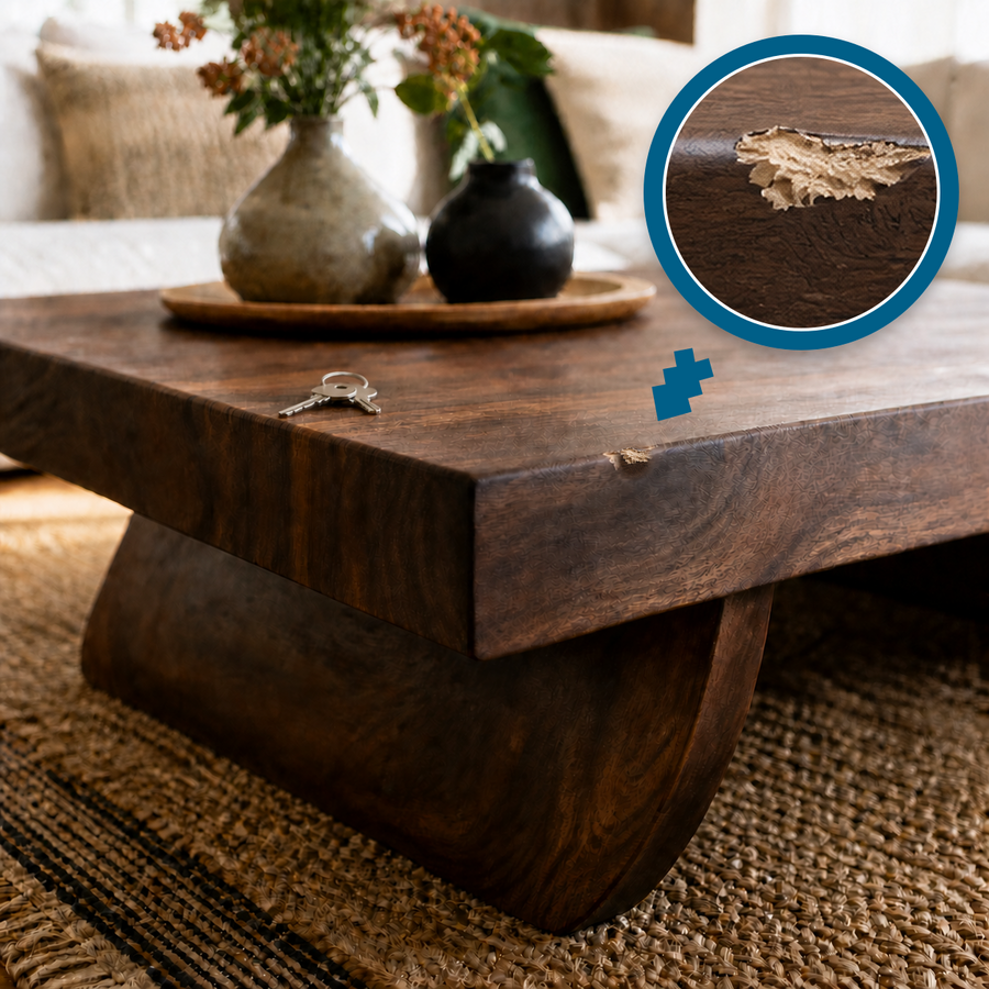 Chipped wooden coffee table edge with a clean magnified close-up and keys nearby
