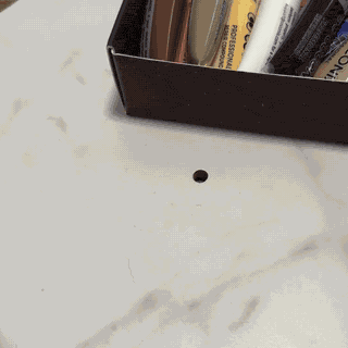 Cleaning and preparing a chipped or holed tile or stone surface for repair