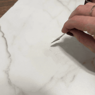 Shaping and leveling a repaired tile or stone chip or hole