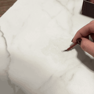 Adding pattern detail and finishing a tile or stone chip or hole repair